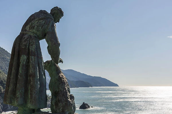 Europe, Italy, Liguria. Monterosso statue of Saint Francis overlooking the sea