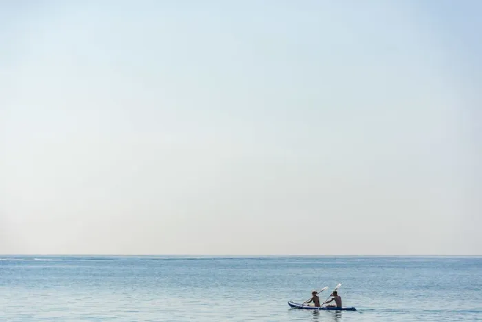 Framed Print : Europe, Italy, Liguria. Paddling a canoe in Monterosso, Cinque Terre