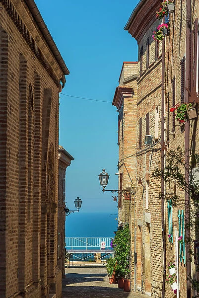 europe, Italy, The Marches. A narrow street in the beautiful hamlet of Torre di Palme near Fermo, with sea view