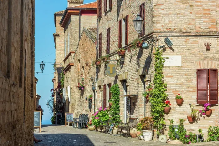 Framed Print : europe, Italy, The Marches. A narrow street in the beautiful hamlet of Torre di Palme near Fermo, with sea view