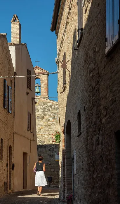 Framed Print : europe, Italy, The Marches. A woman walking in a narrow street in the beautiful hamlet of Torre di Palme near Fermo Framed Print : europe, Italy, The Marches. A woman walking in a narrow street in the beautiful hamlet of Torre di Palme near Fermo