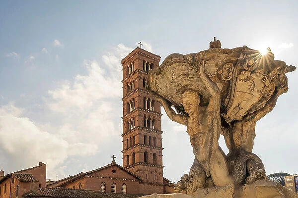 Europe, Italy, Rome. The fountain of the Tritons on the Piazza della Bocca della Verita with the church Santa Maria in Cosmedin in the background