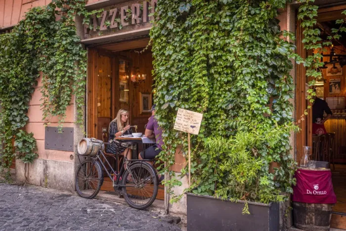Framed Print : Europe, Italy, Rome. A restaurant in Trastevere with a couple eating spaghetti Framed Print : Europe, Italy, Rome. A restaurant in Trastevere with a couple eating spaghetti