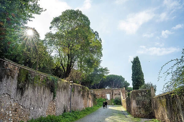 Europe, Italy, Rome. Walking down from the Aventine hill on an ancient footpath