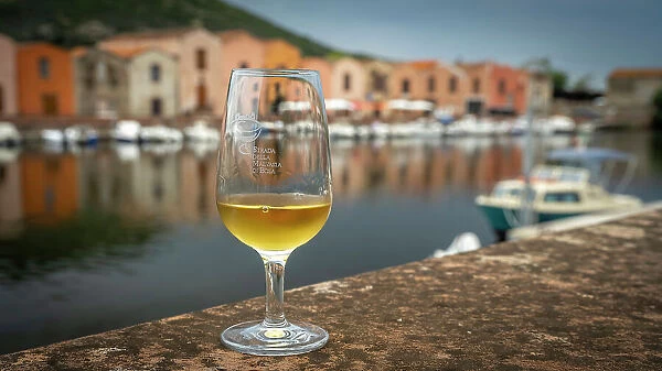 Europe, Italy, Sardinia. A glass of the famous sweet wine of Bosa, called Malvasia