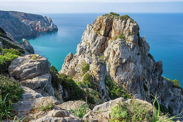 Europe, Italy, Sardinia. The rocky coast near to Buggeru seen from the footpath