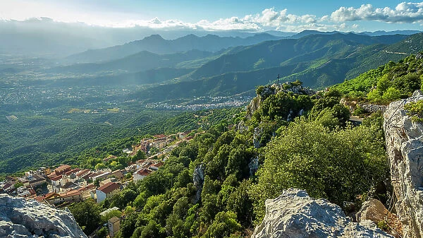 Europe, Italy, Sardinia. View from the mountain down to the village of Baunei
