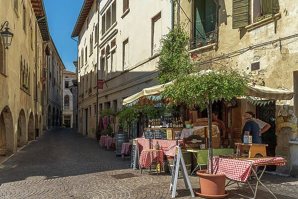 Europe, Italy, Veneto. Asolo, a street with a typical enoteca offering wine and panini
