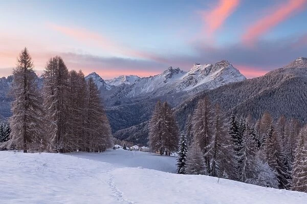 Europe, Italy, Veneto, Belluno, Dolomites. Colorful sunrise over the village of Coi