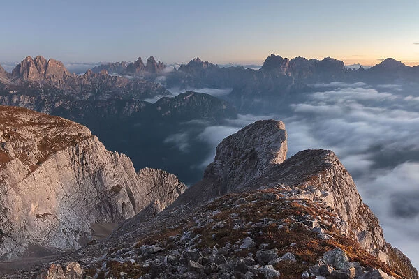 Europe, Italy, Veneto, Cadore, Auronzo. Sunrise with sea of clouds from Camosci peak