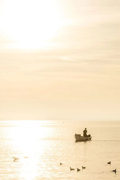 europe, Italy, Veneto. a fisher man at the Garda Lake