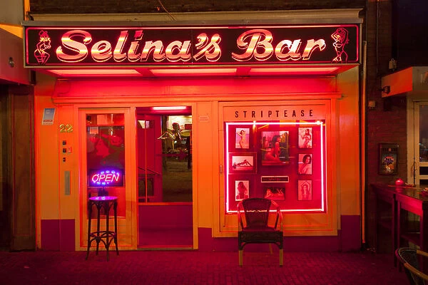Europe, Netherlands, Holland, Amsterdam, Red Light district, a strip bar in the red