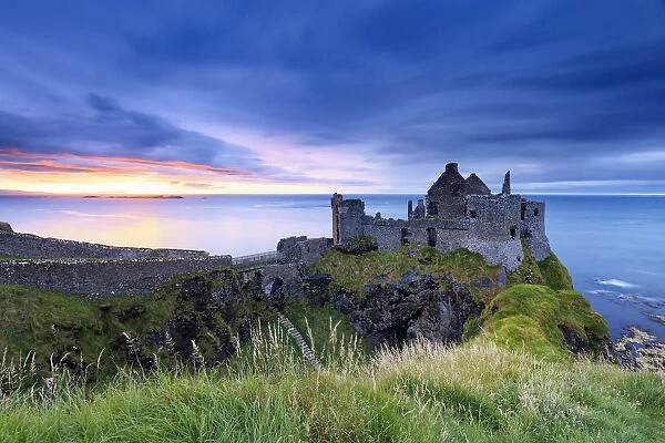 Europe, Northern Ireland, Dunluce Castle at sunset