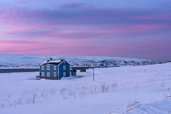 Europe, Norway, Finnmark, Kongsfjord, Veidnes, Blue house at sunset