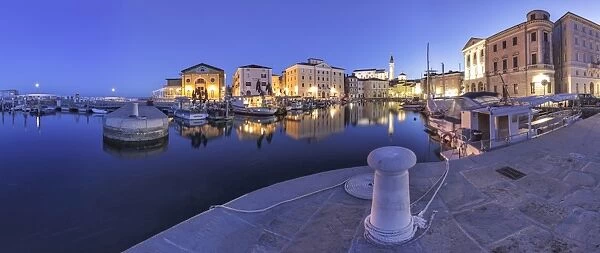 Europe, Slovenia, Istria, Piran. The picturesque port and the buildings around it at dusk