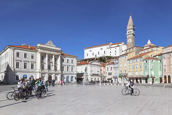 Europe, Slovenia, Istria, Piran. Tourists and bikers in Tartini square