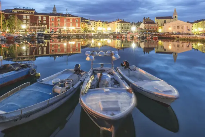Framed Print : Europe, Slovenia, Primorska, Izola. Old town and the harbour with fishing boats at dusk Framed Print : Europe, Slovenia, Primorska, Izola. Old town and the harbour with fishing boats at dusk