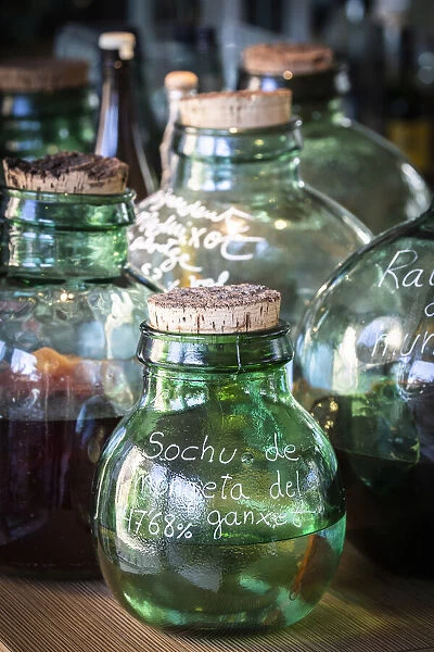 Europe, Spain, Catalonia, Girona, Glass containers with distilled flavours in the El