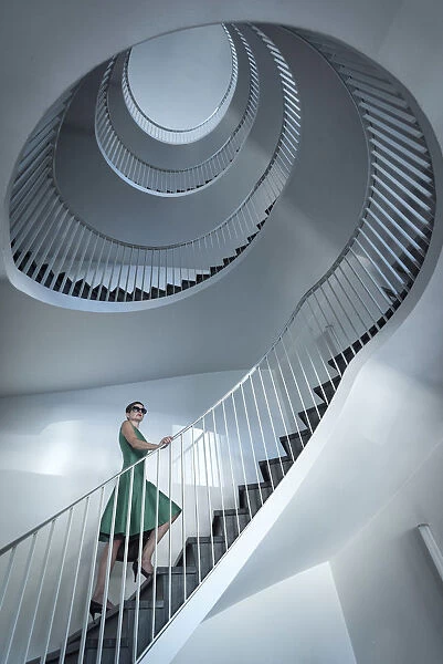 Europe, Switzerland, St. Gallen, woman on a staircase MR