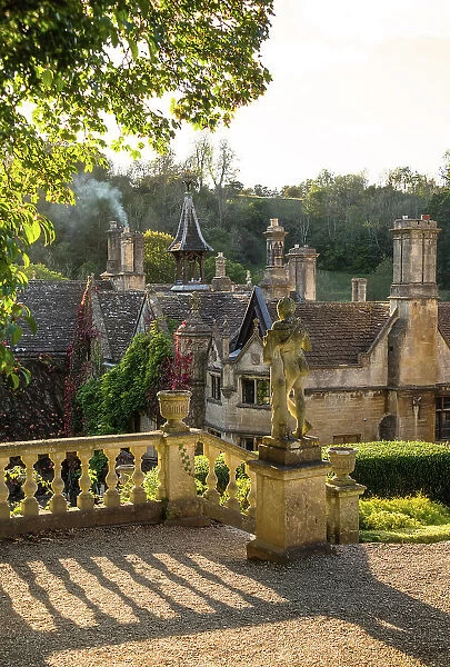 Evening light on The Manor House, 14th century building set in 365 acres of secluded parkland in the Cotswold village Castle Combe, Wiltshire, Cotswolds, England