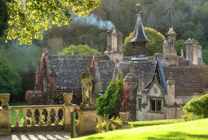 Framed Print : Evening light on The Manor House, 14th century building set in 365 acres of secluded parkland in the Cotswold village Castle Combe, Wiltshire, Cotswolds, England Framed Print : Evening light on The Manor House, 14th century building set in 365 acres of secluded parkland in the Cotswold village Castle Combe, Wiltshire, Cotswolds, England