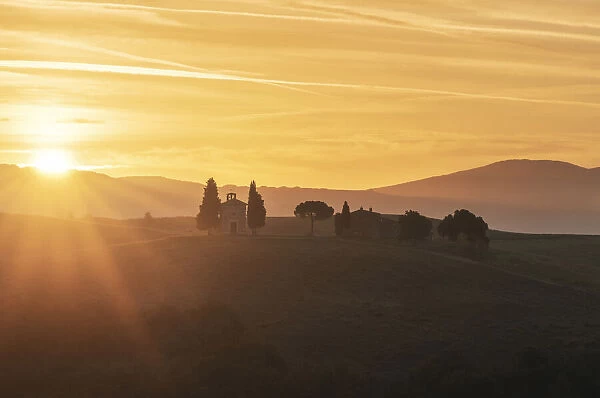 Evening sun on a farm house in Val d Orcia Tuscany, Italy