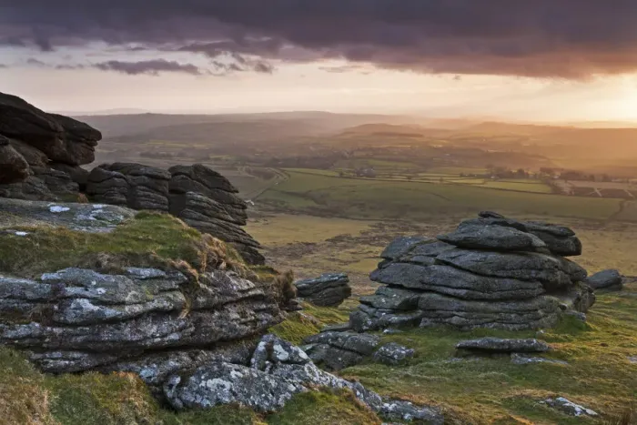 Framed Print : Evening sunlight over Devon countryside, viewed from Arms Tor, Dartmoor, Devon, England Framed Print : Evening sunlight over Devon countryside, viewed from Arms Tor, Dartmoor, Devon, England