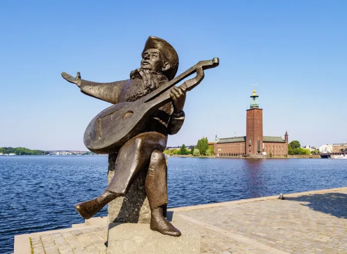 Framed Print : Evert Taube Statue with City Hall in the background, Stockholm, Stockholm County, Sweden Framed Print : Evert Taube Statue with City Hall in the background, Stockholm, Stockholm County, Sweden