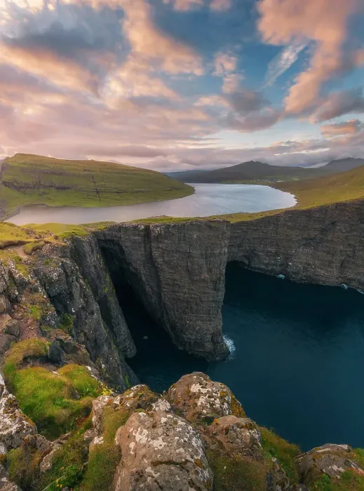 Framed Print : An explosive sunset during a summer evening at the lake above the ocean (Sorvagsvatn), in the Faroe Islands Framed Print : An explosive sunset during a summer evening at the lake above the ocean (Sorvagsvatn), in the Faroe Islands