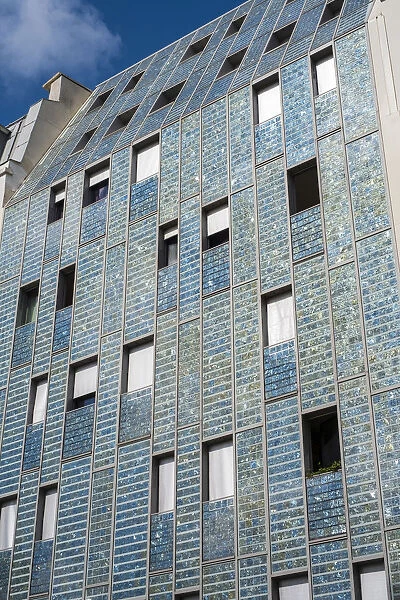 Facade of building covered in Photovoltaic (PV) solar panels for sustainable power