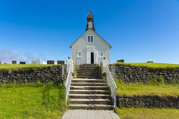 Facade of Strandarkirkja church with steps on sunny day, Selvogur, Reykjanes Peninsula, Iceland