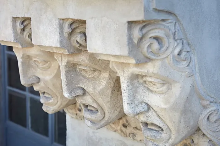 Framed Print : Detail of faces carved on the exterior facade of the historic Framed Print : Detail of faces carved on the exterior facade of the historic