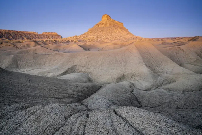 Framed Print : Factory Butte mountain rising above badlands at dawn, Wayne County, Utah Framed Print : Factory Butte mountain rising above badlands at dawn, Wayne County, Utah