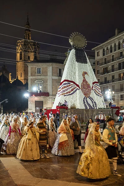 Falleros marching at the flower offering ceremony (ofrena de flors or ofrenda de flores) during the annual Fallas Festival, Valencia, Spain