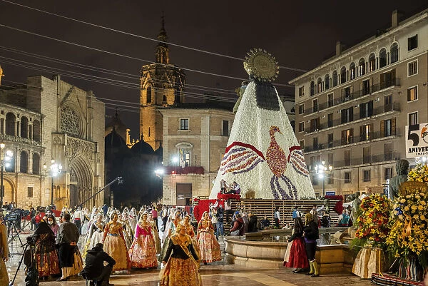 Falleros marching at the flower offering ceremony (ofrena de flors or ofrenda de flores) during the annual Fallas Festival, Valencia, Spain
