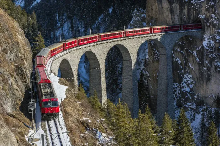 Framed Print : The famous red train of Albula mountain railway while passing on the Landwasser viaduct Framed Print : The famous red train of Albula mountain railway while passing on the Landwasser viaduct
