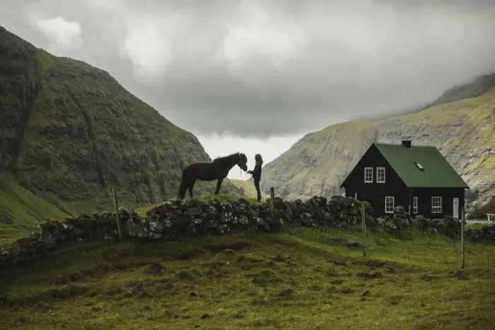 Framed Print : A Faroese girl with her horse in Saksun. Streymoy, Faroe Islands Framed Print : A Faroese girl with her horse in Saksun. Streymoy, Faroe Islands