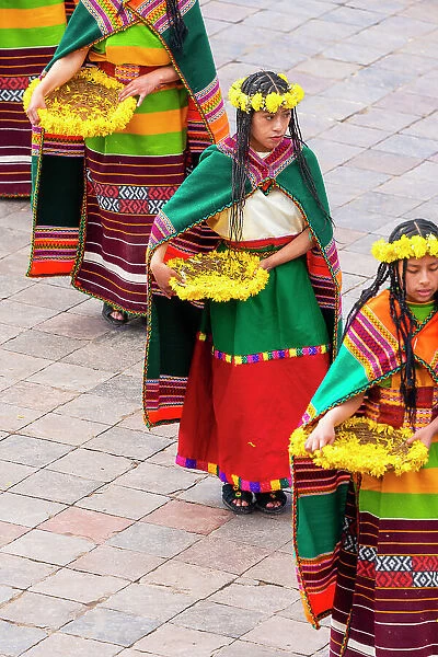 Female performers with plates decorated with yellow flowers during Inti Raymi Festival of the Sun, UNESCO, Cusco, Cusco Province, Cusco Region, Peru