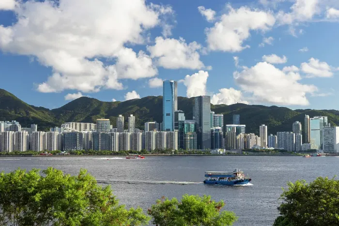 Framed Print : Ferry crossing Victoria Harbour with Quarry Bay skyline in background, Hong Kong Island, Hong Kong