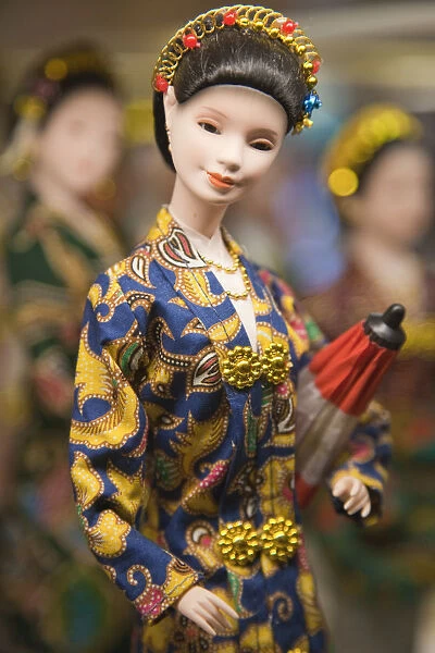 Figurine of Asian woman in traditional dress, Singapore
