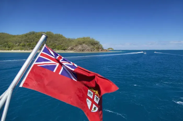 Framed Print : Fijian flag and Malolo Island, Mamanuca Islands, Fiji