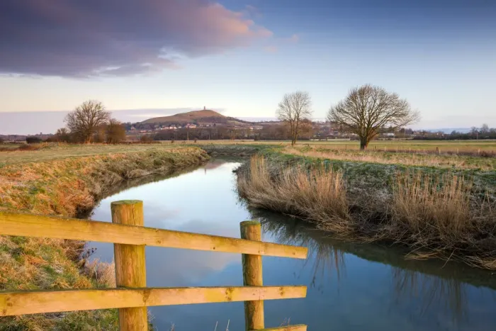 Framed Print : First light of morning on Glastonbury Tor viewed from the River Brue on the Somerset Framed Print : First light of morning on Glastonbury Tor viewed from the River Brue on the Somerset