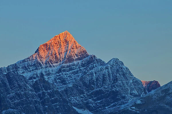 First light on a peak of the Canadina Rocky Mountains, Icefields Parkway, Jasper National Park, Alberta, Canada