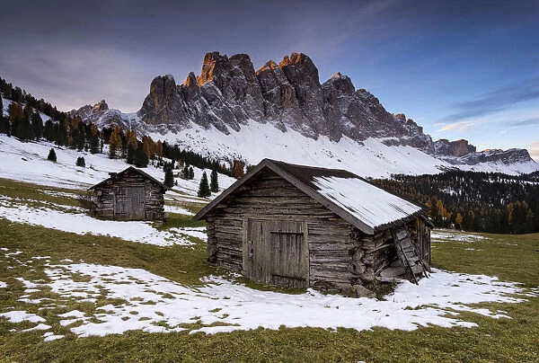 First light on the peaks with huts. Val di Funes, Trentino Alto Adige, Italy
