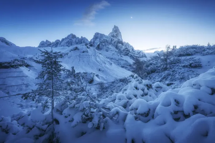 Framed Print : The first snow of the year in late autumn at Rolle Pass, with the majestic Pale di San Martino in the background and the rising moon in the sky. Dolomites, Italy