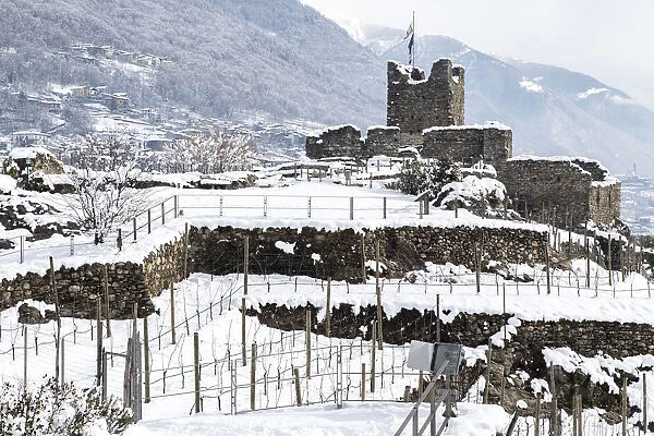 The first tower of the ancient and mysterious fortress of Castel Grumello in winter