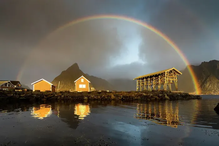 Framed Print : Fishermen cabins under a dramatic cloudy sky with rainbow at dawn, Sakrisoy, Reine, Nordland county, Lofoten Islands, Norway Framed Print : Fishermen cabins under a dramatic cloudy sky with rainbow at dawn, Sakrisoy, Reine, Nordland county, Lofoten Islands, Norway