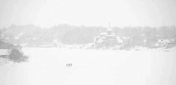 Fishermen on the frozen Volkhov River with Nikolsky monastery in the background, Staraya
