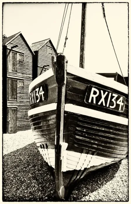 Framed Print : A fishing boat and the net shops ( a weather-proof storage for the fishing gear) Framed Print : A fishing boat and the net shops ( a weather-proof storage for the fishing gear)