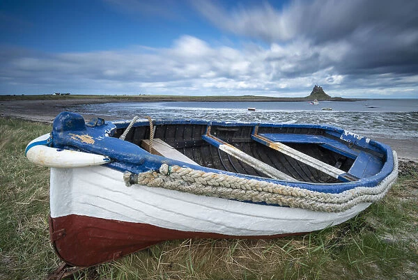 Fishing boat pulled ashore on the Holy Island of Lindisfarne, Northumberland, England